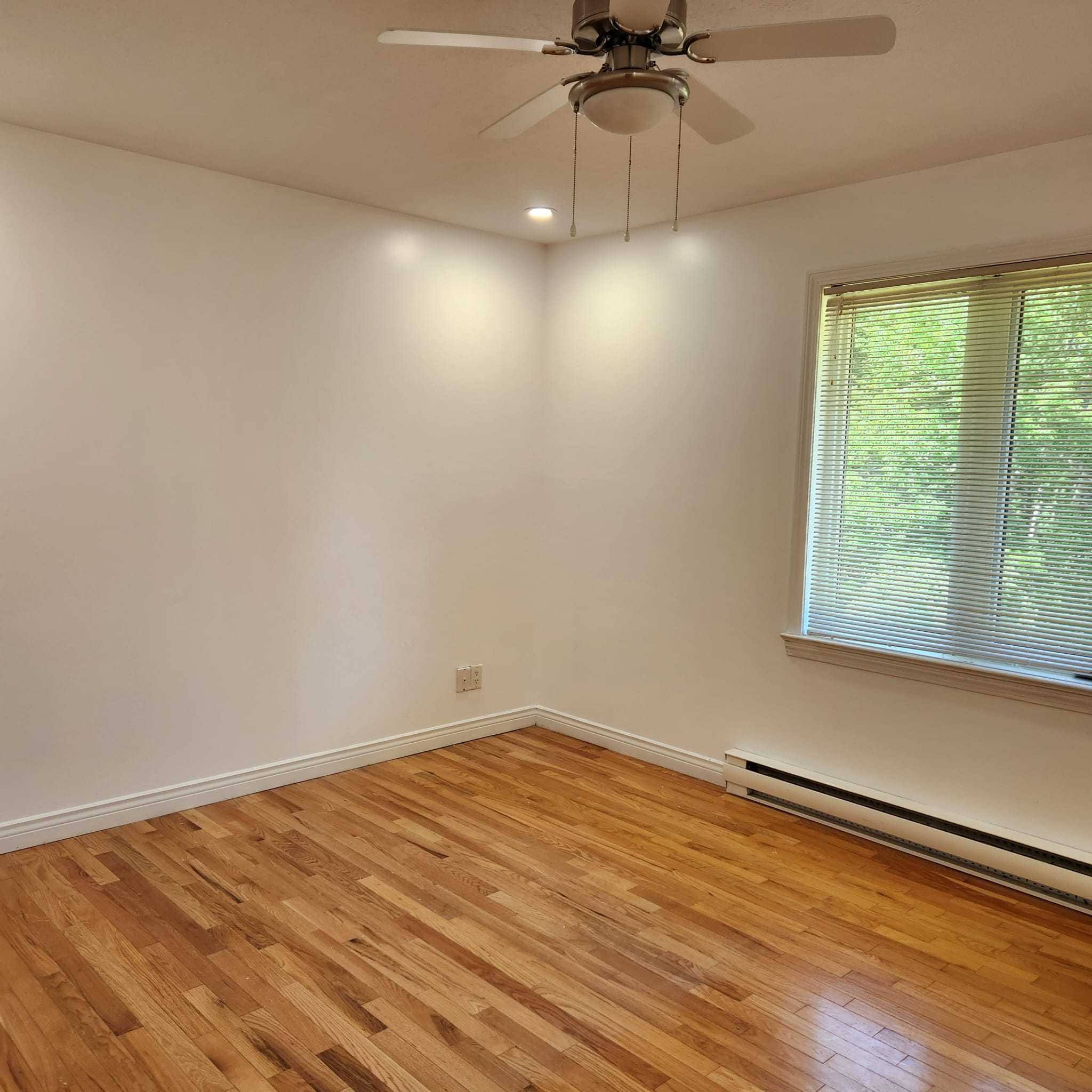 The completed room with fresh white walls and trim